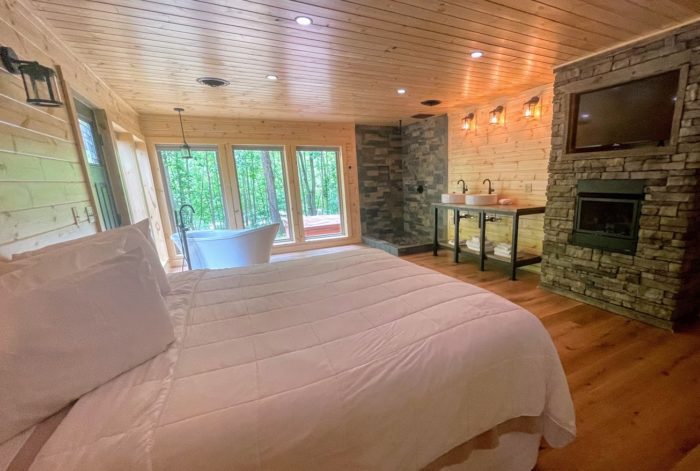 Riverside Retreat master suite at Harman's Luxury West Virginia cabin rentals.