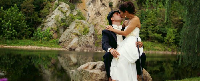 A bride and groom kissing.