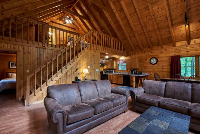 West Virginia log cabin with living area and second floor.