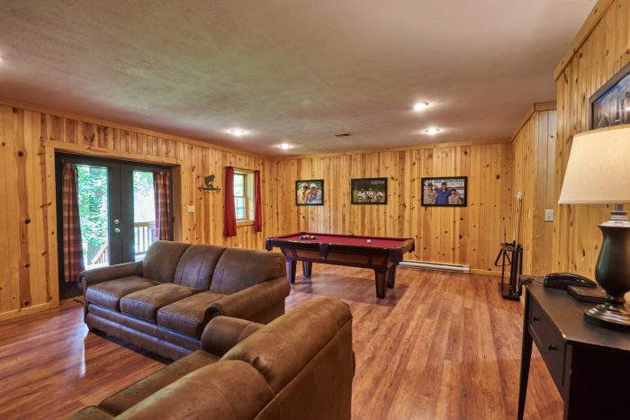 Game and lounge room in Harman's Fly Rod Chronicles West Virginia cabin rental.