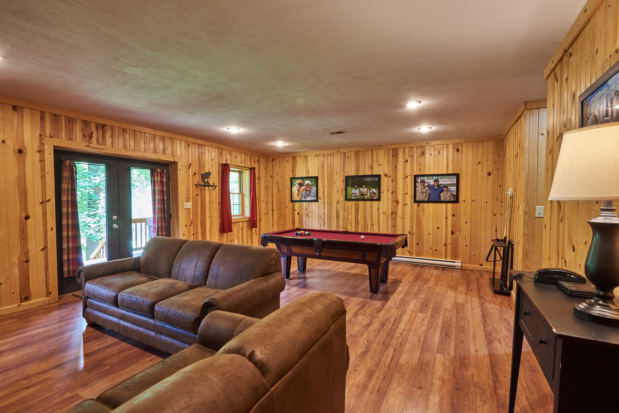 Game and lounge room in Harman's Fly Rod Chronicles West Virginia cabin rental.